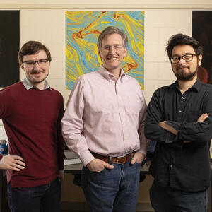Professor Charles Gammie, center, and graduate students Ben Prather, left, and Charles Wong, right.